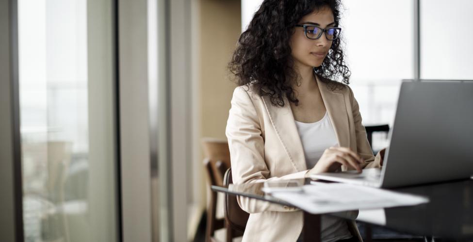 Woman working on a laptop in an office