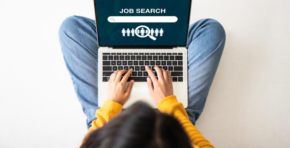 Woman searching for jobs on laptop