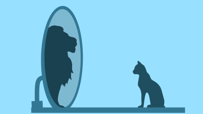 A house cat seems themselves as a lion in the mirror