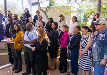 Rio employees and guests reciting a song during MLK Day event