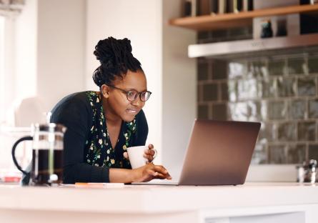 Woman working on laptop in home office