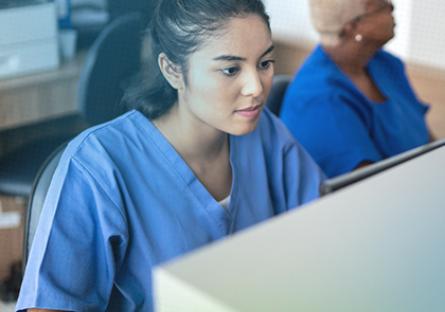 Medical Assisting student on a computer in the classroom