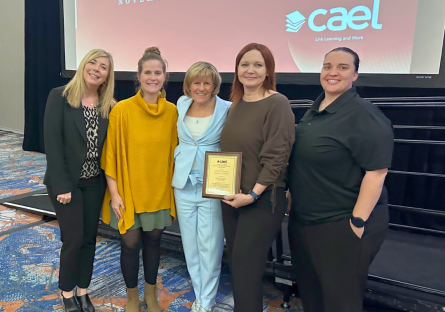 President Smith and Rio staff accepting award at CAEL luncheon