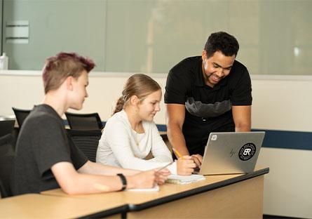 Rio graduate in the classroom teaching math to secondary education students