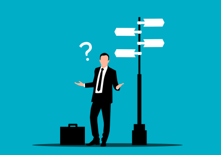 Cartoon of confused man with briefcase standing at crossroads