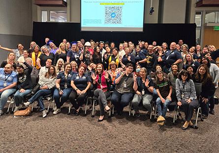 employee group photo at a meeting