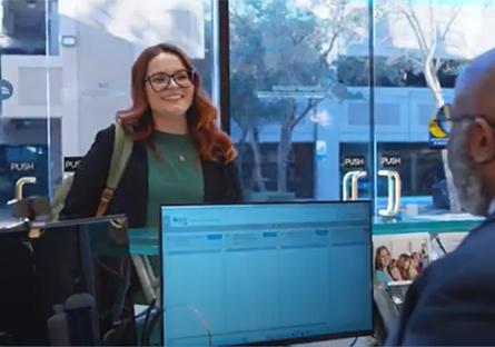 Student at the welcome desk receiving information