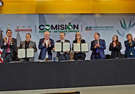 Members of Arizona-Mexico Commission (AMC) and Comisión Sonora Estados Unidos (CSEU) attending the 65th Annual Plenary Meeting holding up signed MOUs