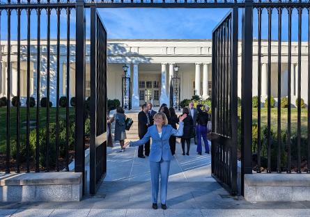 President Kate Smith at the gates in the front of the White House