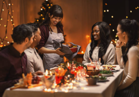 A group of friends celebrate the holidays over dinner