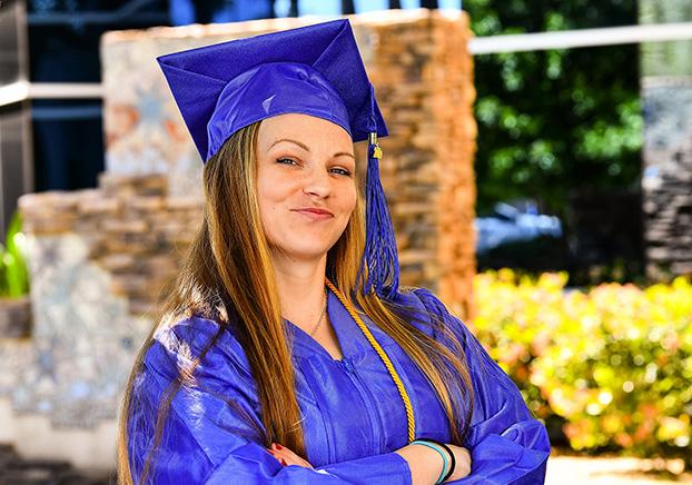 Female Student in cap and gown